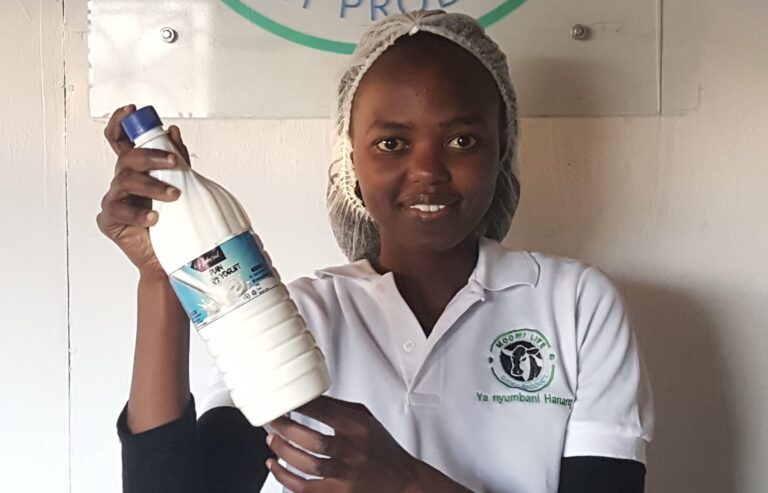 Glory Mtei Holding one of her products