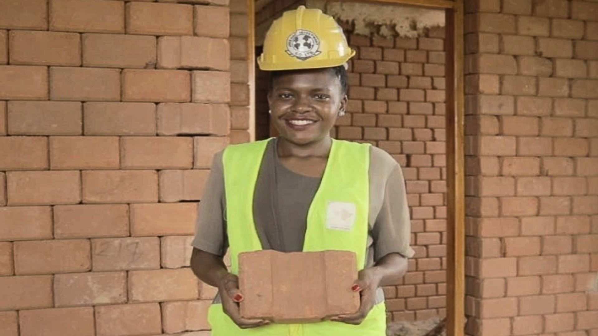 Jofenai Holding one of her bricks